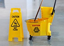 mop and sign on floor